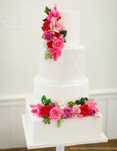 Romantic Wedding Cake featuring Sugar Lace with Pink & Red Sugar Flowers | The Quintessential Cake | Chicago | Luxury Wedding Cakes | Chicago Illuminating Company